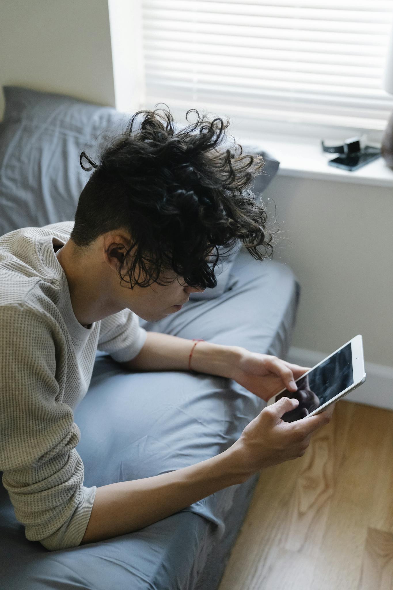 Young guy texting on mobile phone